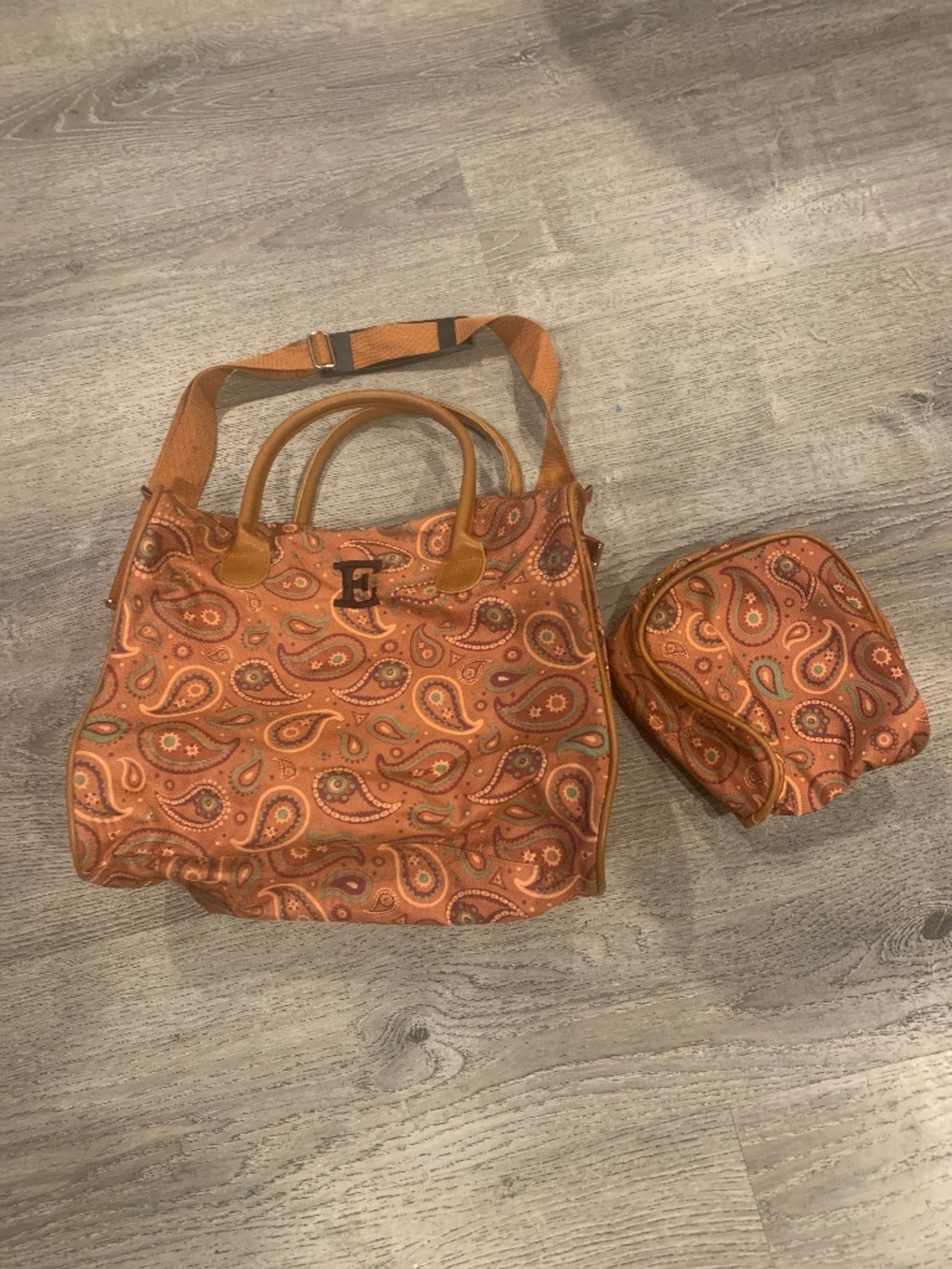 Travel bag with cosmetic bag. “E”